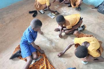 Students in Ghana engage with hands-on activities designed to support foundational learning.