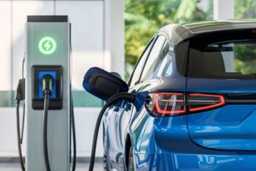 Image of electric vehicle connected to a charger