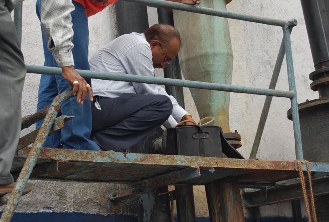 man conducting a pollution audit in Gujarat, India