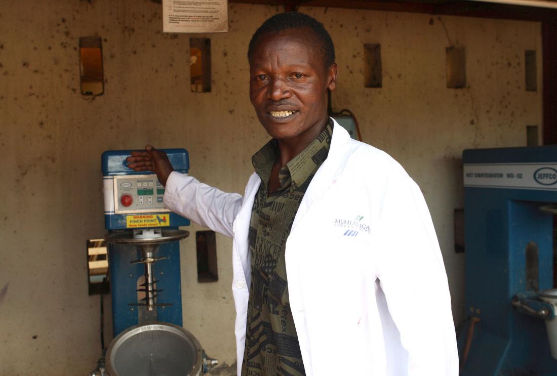 A factory worker poses in Kenya.