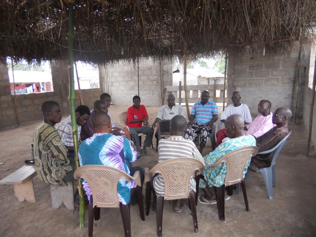 Group discussion about health insurance enrollment, healthcare, and health insurance quality with a group men from the village