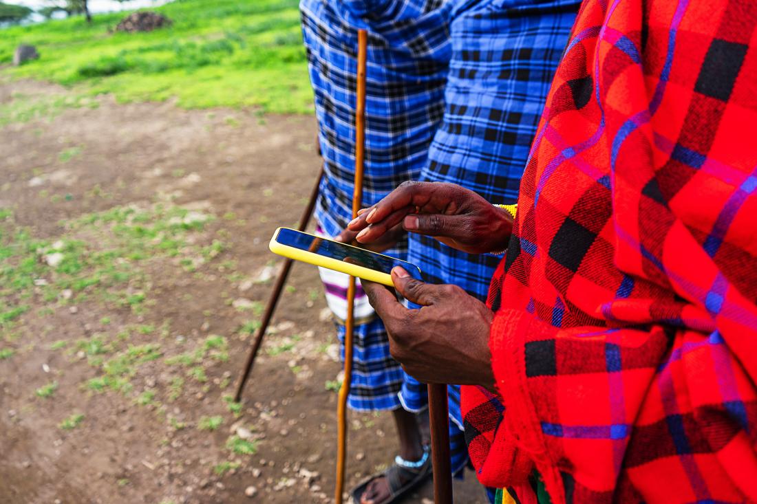 A Man is Texting on a Phone