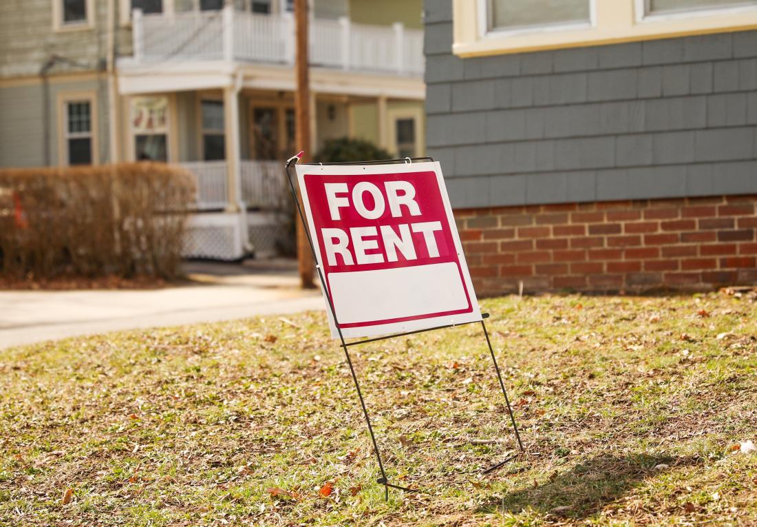 Red For Rent sign on lawn