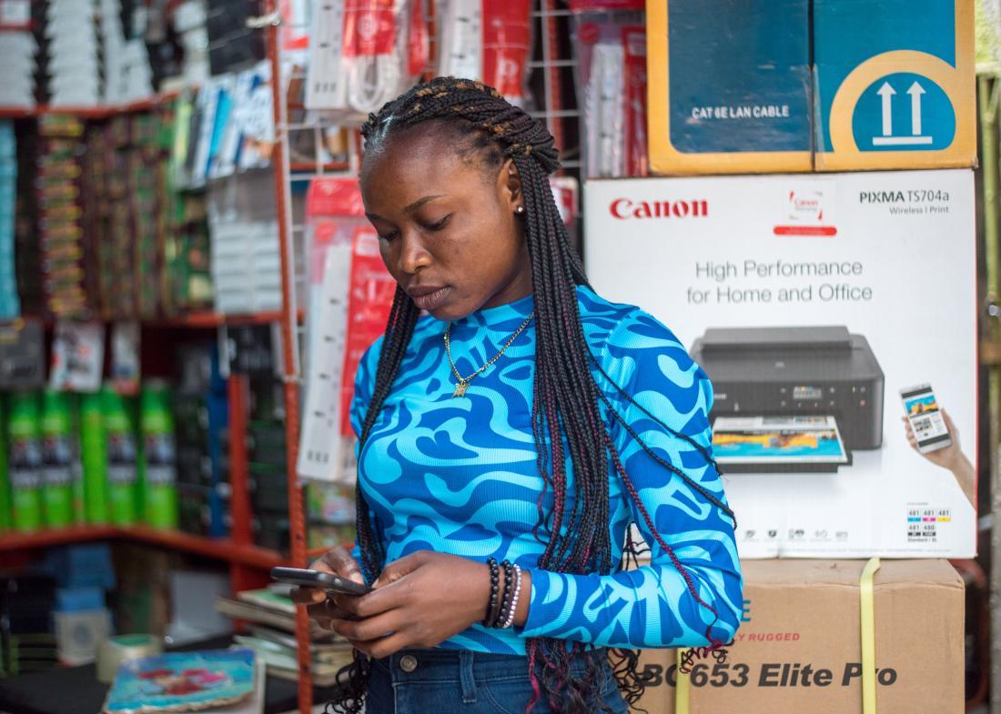 Woman on cell phone in Nigeria.