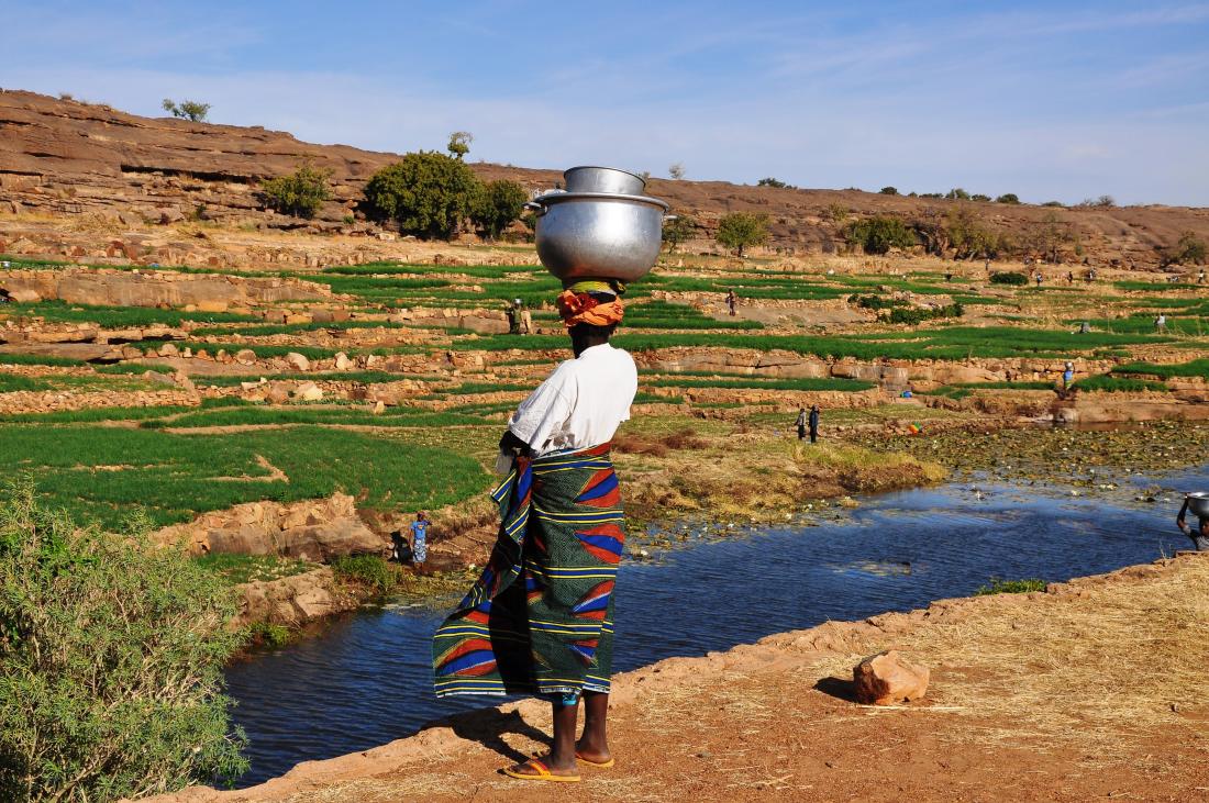 Local farmer works in the countryside near Banani village