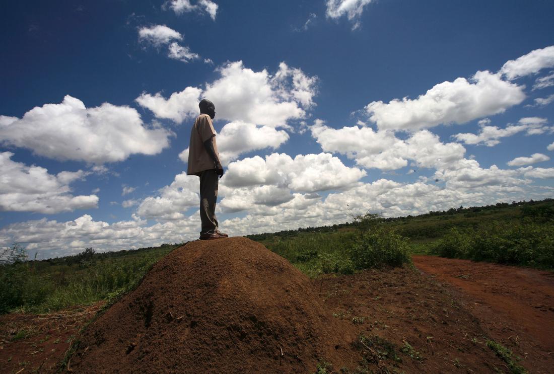 A man is looking out over the land in Kenya. 