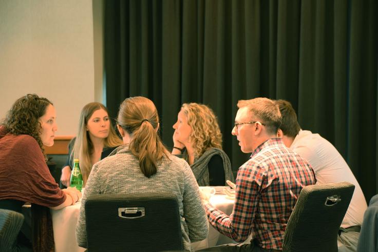 People in discussion at a table