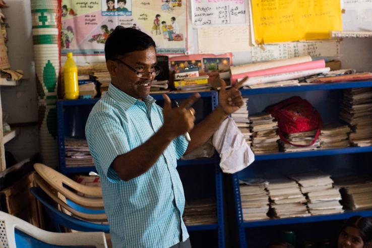 A teacher gives a lively lecture to students