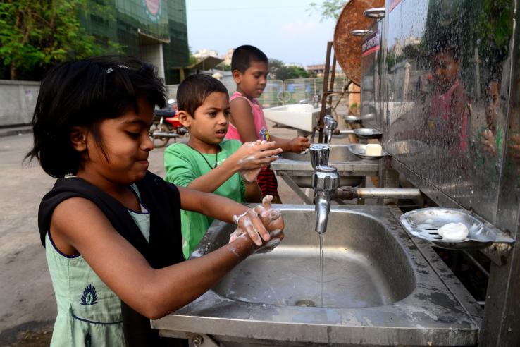 Children washing their hands in Dhaka, Bangladesh.