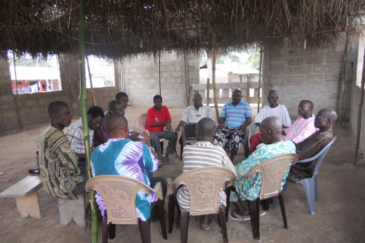Group discussion about health insurance enrollment, healthcare, and health insurance quality with a group men from the village