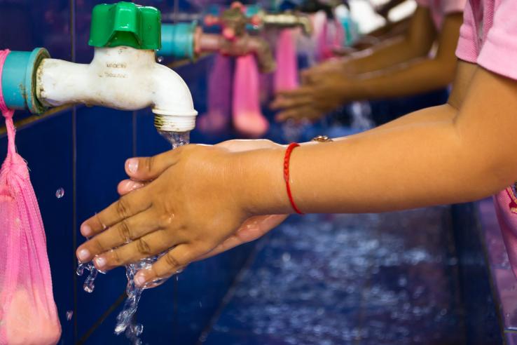 Students washing their hands at school