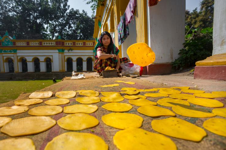 A small business woman making on handmade Pappor