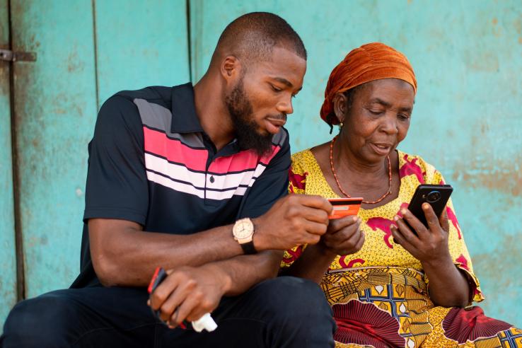 Man and women with mobile phone and credit card