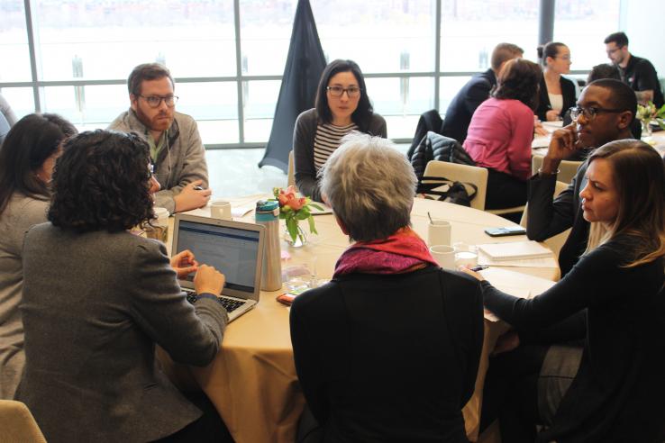 Participants discuss open questions around eight developing evaluations during a breakout session at the year 3 convening