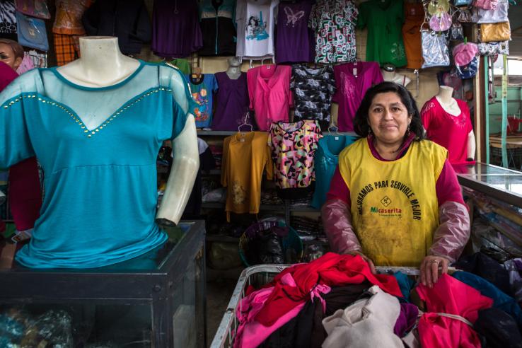 Female garment vendor at an informal market