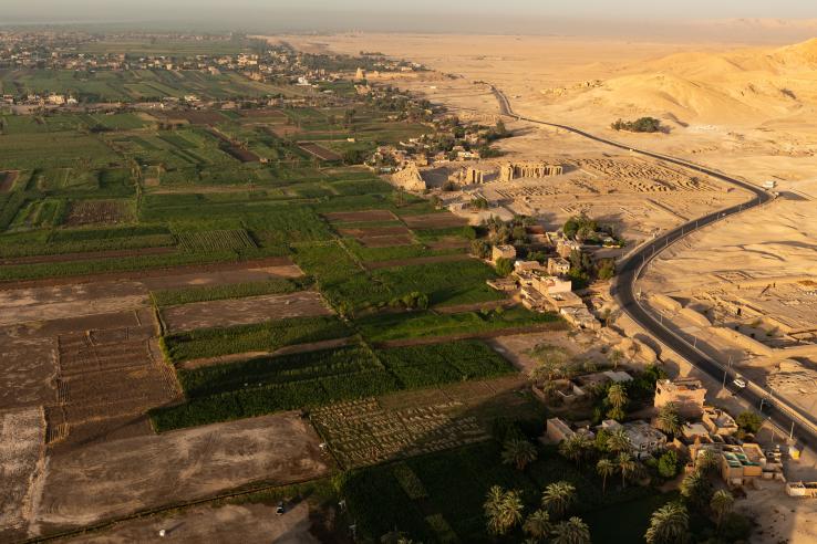 Aerial view of irrigated nile river valley meeting the dry arid desert