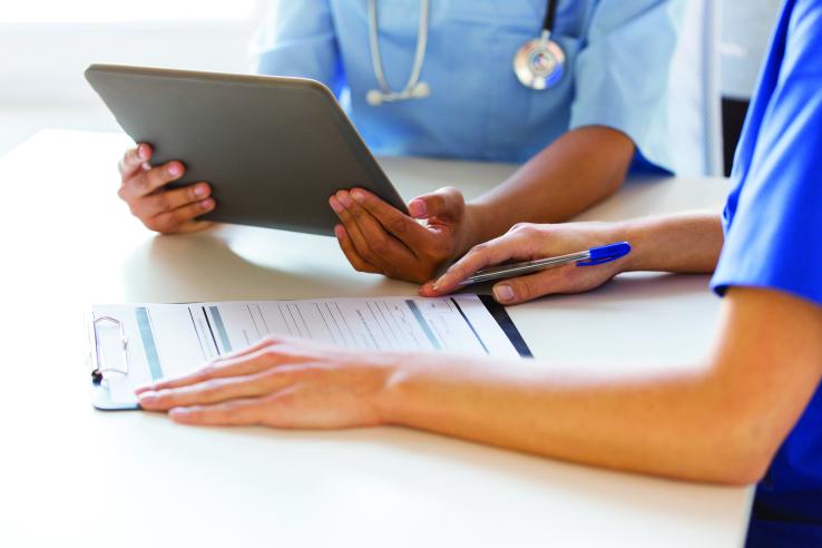 Doctor looking at paperwork