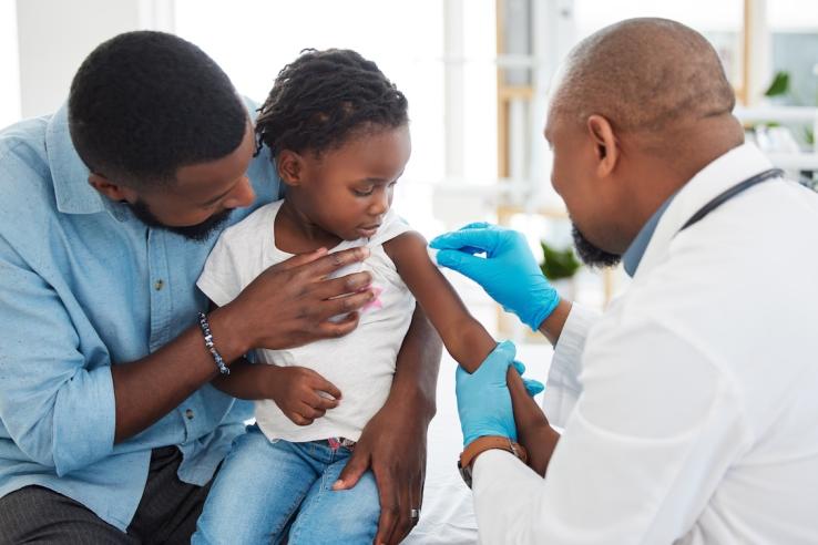 Young child gets vaccinated for influenza