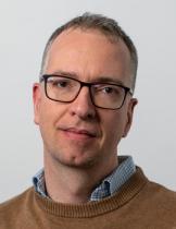 Adam Szeidl Headshot