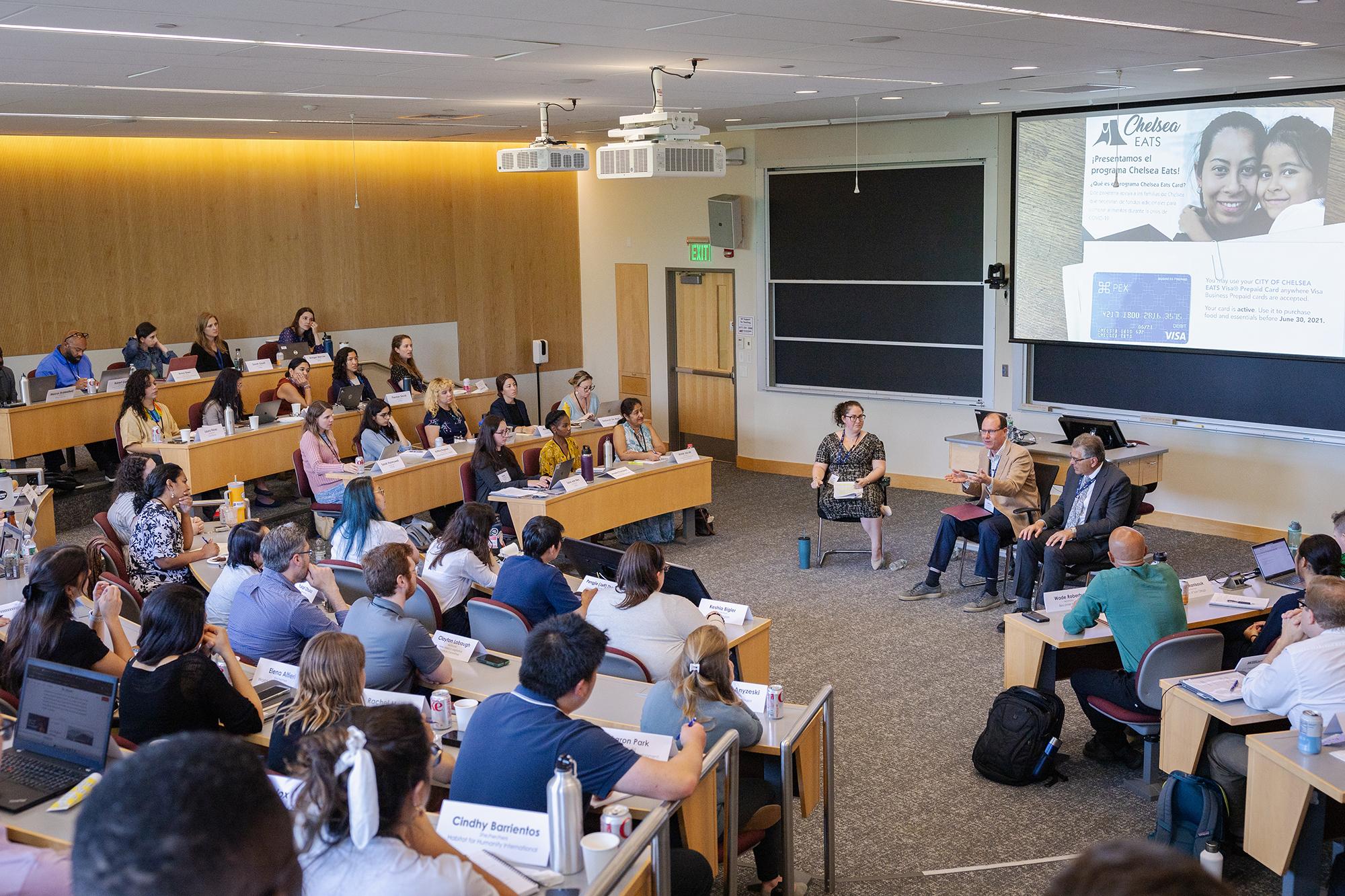 Full classroom with three panel speakers in front