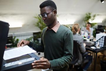 A man photocopies a document