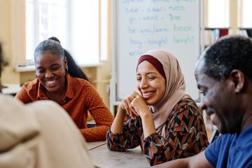 Entrepreneurs exhibiting soft skills in a group meeting.