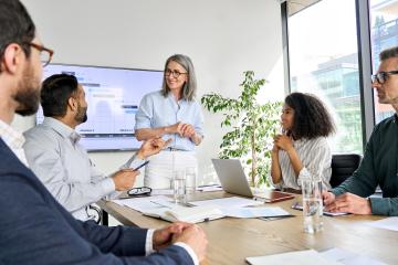 Group of people talking in conference room